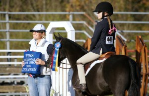 Elizabeth, Terri and Rock Star posing for award at WIHS Local Day