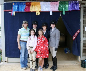 Clairvaux Riders and Terri in front of our tack stall and banner at Lexington National 2010 / VHSA Medal Finals